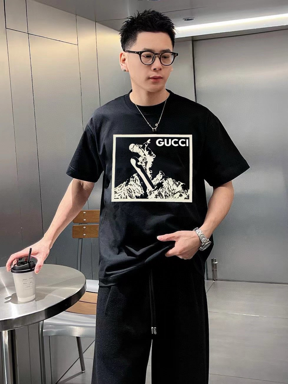 G*u*i snowboarder graphic black t-shirt