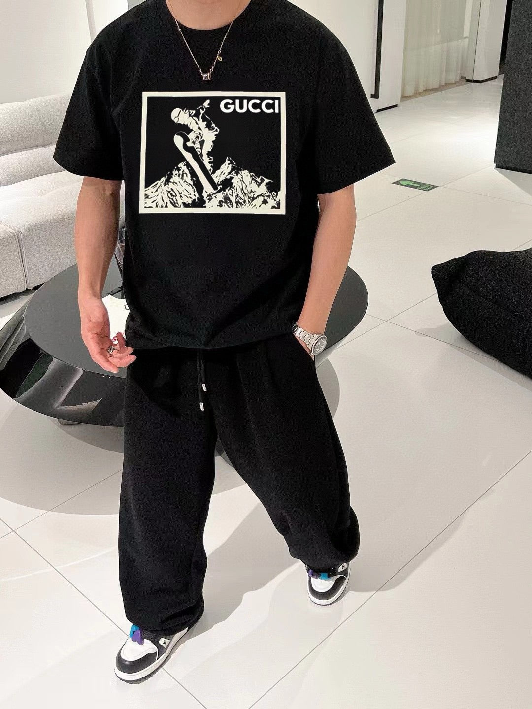 G*u*i snowboarder graphic black t-shirt